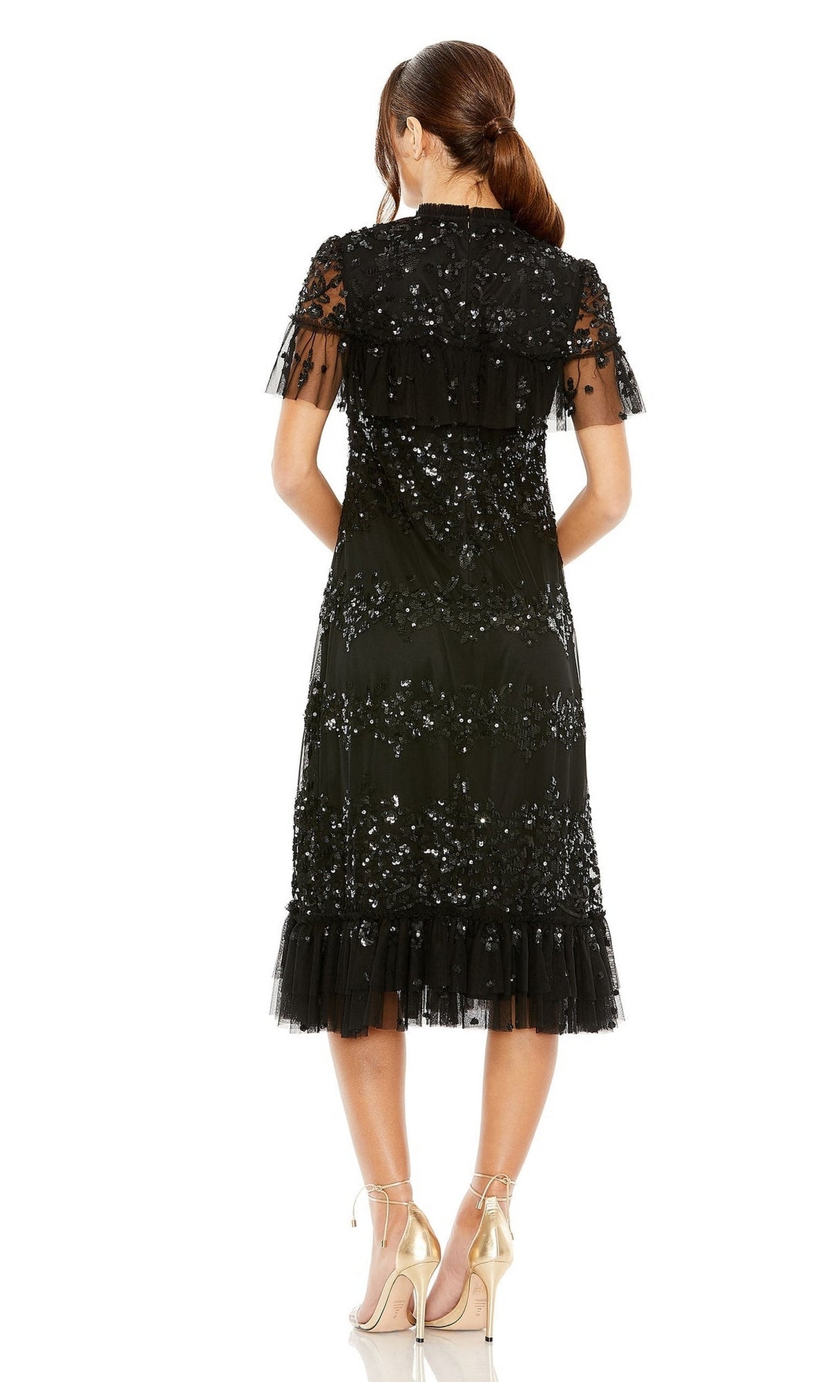 A woman stands facing away, wearing the Mac Duggal 9193 Black Midi Wedding Guest Dress with sequin details and ruffled hem—an elegant semi-formal choice for special occasions.